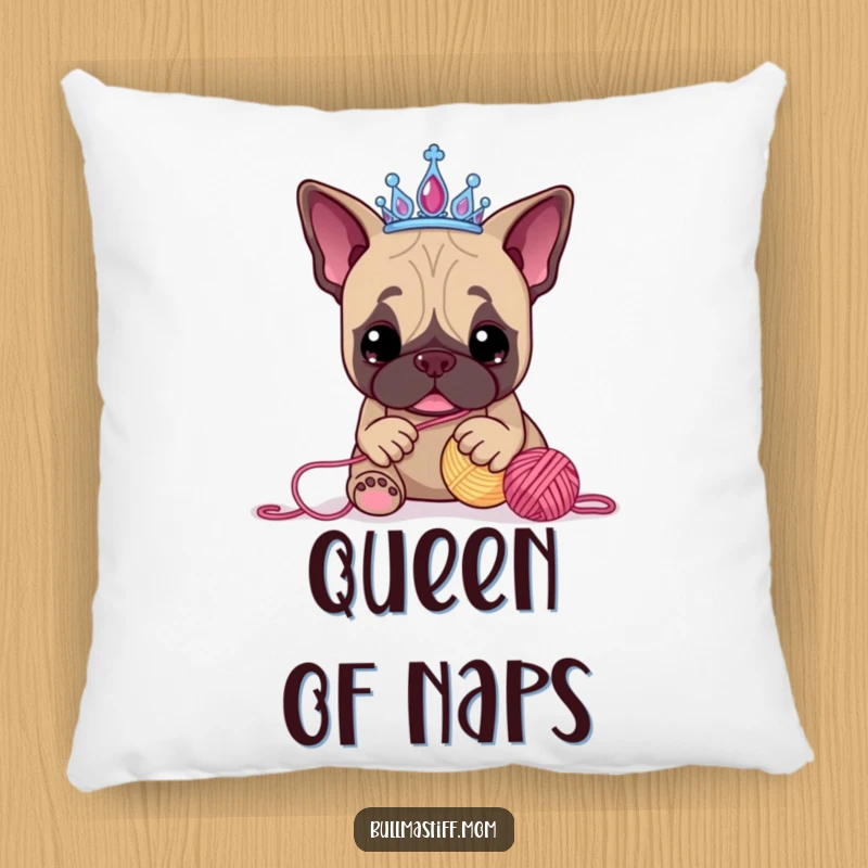 Funny Bullmastiff pillow showcasing a dog wearing a tiara, hilariously playing with a ball of yarn, offering comfort and a smile.