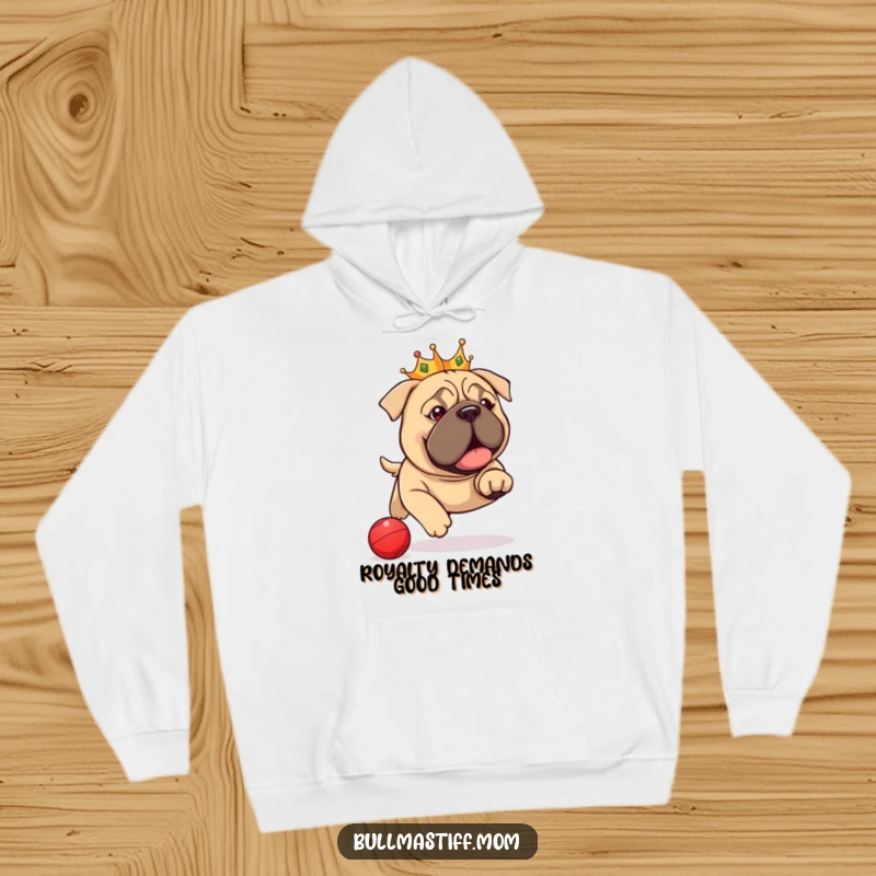 Funny Bullmastiff Hoodie: A kingly dog in a tiny crown zealously pursuing a red ball, perfect for cozy, humorous moments.