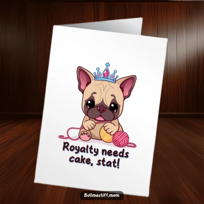 Funny Free Printable Birthday Card: Bullmastiff princess in tiara playfully batting at a yarn ball, ready to celebrate.
