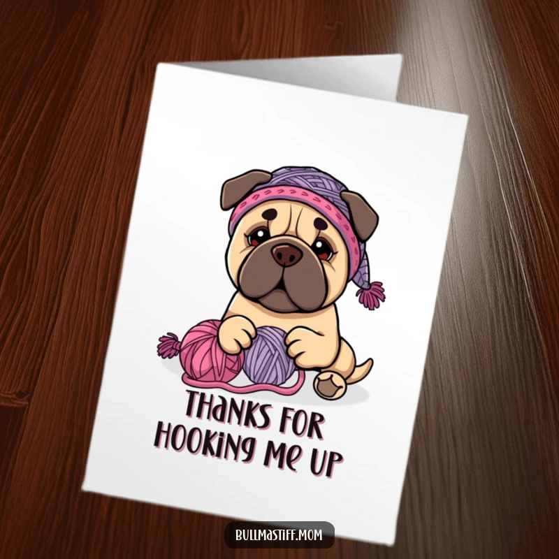 Funny Free Printable Thank You Card: Bullmastiff wearing a knit hat happily plays with yarn.