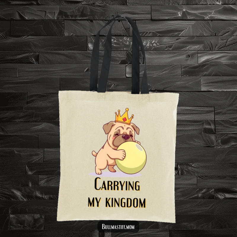 Funny Bullmastiff wearing a crown, nudging a giant ball, on a stylish and functional tote bag.