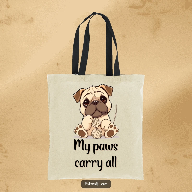 Funny Bullmastiff tote bag featuring a dog with oversized paws hilariously playing and tangling with a ball of yarn.
